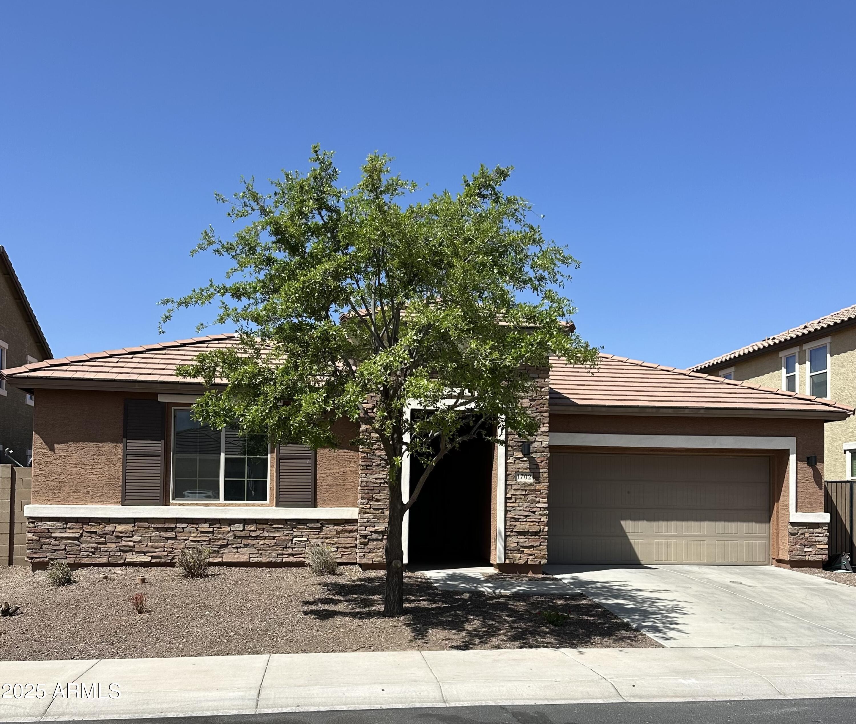 1702 N 214TH Lane, Buckeye, AZ 85396 — Photo 1 of 21