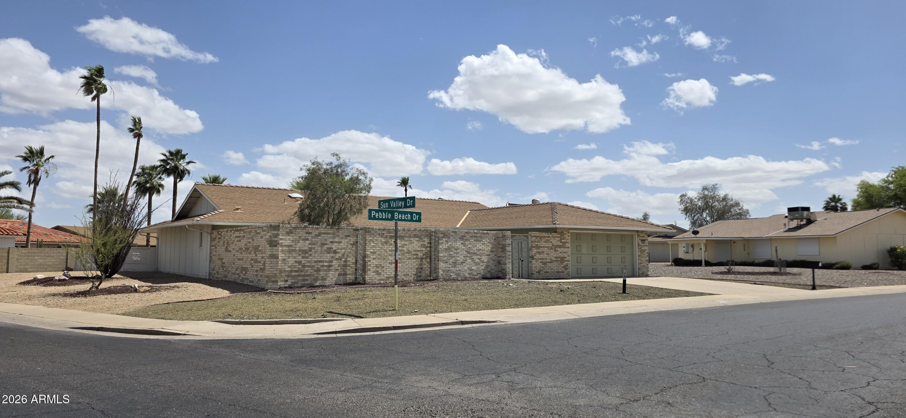 9803 W PEBBLE BEACH Drive, Sun City, AZ 85351 — Photo 1 of 32