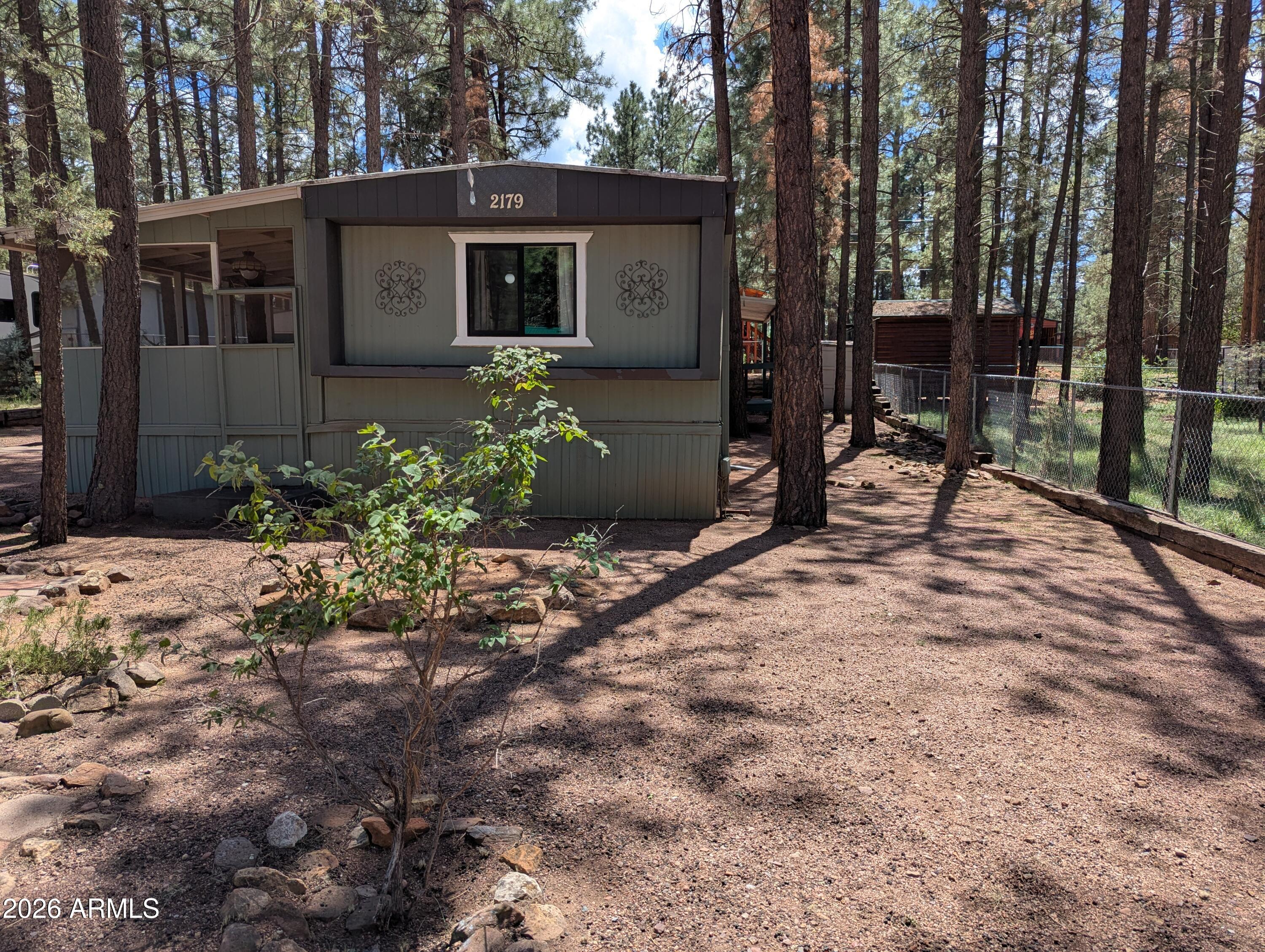 2179 N WOODS Drive, Overgaard, AZ 85933 — Photo 1 of 28